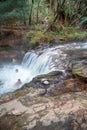 WAIOTAPU, NEW ZEALAND - SEPTEMBER 1, 2018: Tourists and locals enjoy natural thermal bath in Kerosene Creek