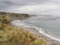 Waipapa Point beach on South Island of New Zealand in a cloudy autumn afternoon