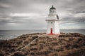 Waipapa point lighthouse in moody weather Royalty Free Stock Photo