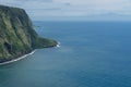 Waipio Valley vista on the Big Island of Hawaii with Maui silhouette in the background