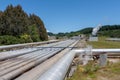 Wairakei geothermal power station steaming pipeline perspective, New Zealand