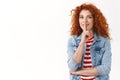 Waist-up happy redhead curly cheerful feminine woman hiding interesting surprise shushing have secret show shhh sign Royalty Free Stock Photo