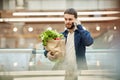 Adult Man Calling by Smartphone in Mall Royalty Free Stock Photo