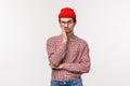 Waist-up portrait bored and unimpressed skeptical young man in red beanie, glasses, facepalm and smirk, grimacing