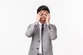 Waist-up portrait of embarrassed and shocked young asian male office worker see something awkward, gasping cover eyes Royalty Free Stock Photo