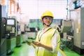 adult woman working at factory by tablet Royalty Free Stock Photo