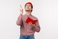 Waist-up portrait of funny male scientist working on project, passionatly look up and raise pen as have perfect idea