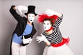 Waist-up portrait of funny mime couple with white faces. April Fools' Day - concept Royalty Free Stock Photo