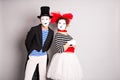 Waist-up portrait of funny mime couple with white faces. The concept of Valentine's Day, April Fool's Day Royalty Free Stock Photo