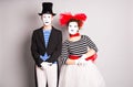 Waist-up portrait of funny mime couple with white faces. The concept of Valentine's Day, April Fool's Day Royalty Free Stock Photo