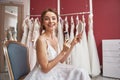 Smiling bride in wedding dress doing make-up Royalty Free Stock Photo