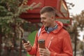 Pleased sportive man looking at his smartphone Royalty Free Stock Photo
