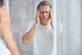 Adult Caucasian man having a temporal pain Royalty Free Stock Photo