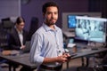 Waist up portrait of man looking at camera standing in office Royalty Free Stock Photo