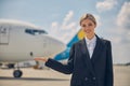 Young airline employee smiling at the camera Royalty Free Stock Photo