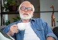 Thoughtful mature man enjoying jot coffee Royalty Free Stock Photo