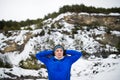 A waist-up portrait of senior man stretching before the run in winter nature. Royalty Free Stock Photo