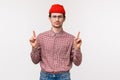Waist-up portrait skeptical and unamused bored young man with beard, wear glasses and red beanie, look reluctant camera