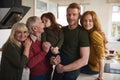 Delighted family before dinner in kitchen Royalty Free Stock Photo