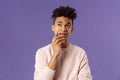 Waist-up portrait of thoughtful unsure young hispanic male student trying solve exercise, looking up thinking, pondering Royalty Free Stock Photo