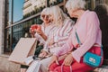 Modern grandmothers are looking at new stylish clutch Royalty Free Stock Photo