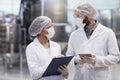 Two Workers at Pharmaceutical Factory Royalty Free Stock Photo