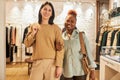 Waist up portrait of two young women shopping together Royalty Free Stock Photo