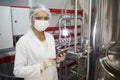 African American Woman Working at Chemical or Pharmaceutical Plant