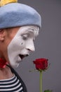 Waist-up portrait of young male mime holding a Royalty Free Stock Photo