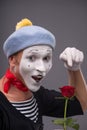 Waist-up portrait of young male mime holding a Royalty Free Stock Photo