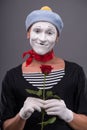 Waist-up portrait of young male mime holding a Royalty Free Stock Photo