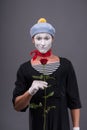 Waist-up portrait of young male mime holding a Royalty Free Stock Photo