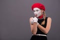 Waist-up portrait of young mime girl showing Royalty Free Stock Photo