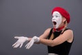 Waist-up portrait of young mime girl showing Royalty Free Stock Photo