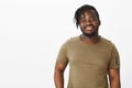 Waist-up shot of charming outgoing african american guy with beard and moustache in military t-shirt, smiling broadly