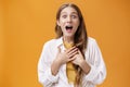 Waist-up shot of excited and thrilled happy expressive european woman in blouse over t-shirt gasping from amazement and