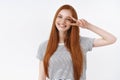 Waist-up shot friendly kind optimistic attractive young lucky teenage redhead girl blue eyes tilting head smiling white