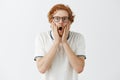 Waist-up shot of shocked speechless guy learning shook news. Portrait of astonished and amazed emotive redhead male with