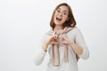 Waist-up shot of sociable happy and friendly caucasian brunette in trendy glasses, blouse and pullover tied over neck