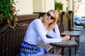 Wait for waitress. Woman sits alone bored cafe terrace urban background defocused. Girl sit alone cafe waiting waitress