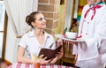 Waiter brings a dish for a nice woman Royalty Free Stock Photo