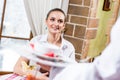 Waiter brings a dish for a nice woman Royalty Free Stock Photo