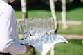 Waiter brings empty glasses