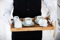 Waiter Carrying Coffee Set