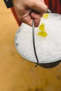 Waiter carrying a metal bucket full of ice to cool drinks in summer Royalty Free Stock Photo