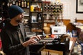waiter cashes in at antique cash register. In a traditional bar. Old restaurant of all life. Spain Royalty Free Stock Photo