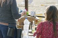 The waiter counts the customer in a cafe on the beach.