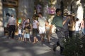 Waiter delivering drinks at outdoor cafÃ¯Â¿Â½ on Passeig de GrÃ¯Â¿Â½cia in the Eixample district, busy street in Barcelona, Spain