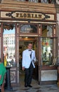 A waiter at f the iconic Florian cafe in Saint Mark's Square, Venice, Italy