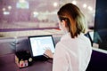 Waiter girl working with pos terminal or cashbox at cafe. People and service concept